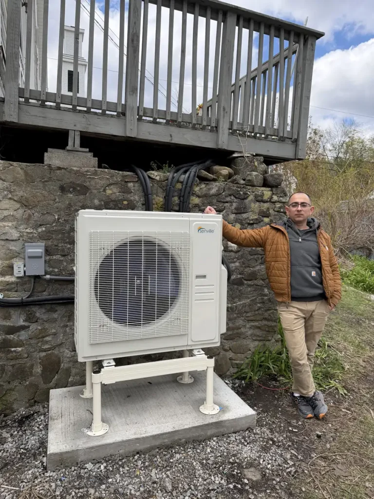 Astello LLC technician with a newly installed outdoor mini-split condenser in East Greenbush, NY.