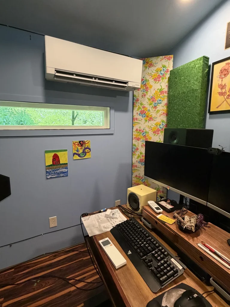 A white Mitsubishi Electric ductless mini-split indoor wall unit cleanly installed by Astello LLC, Albany NY