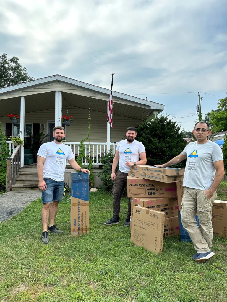 Astello LLC HVAC technicians with Cooper & Hunter equipment boxes outside a customer's house, Saratoga, NY