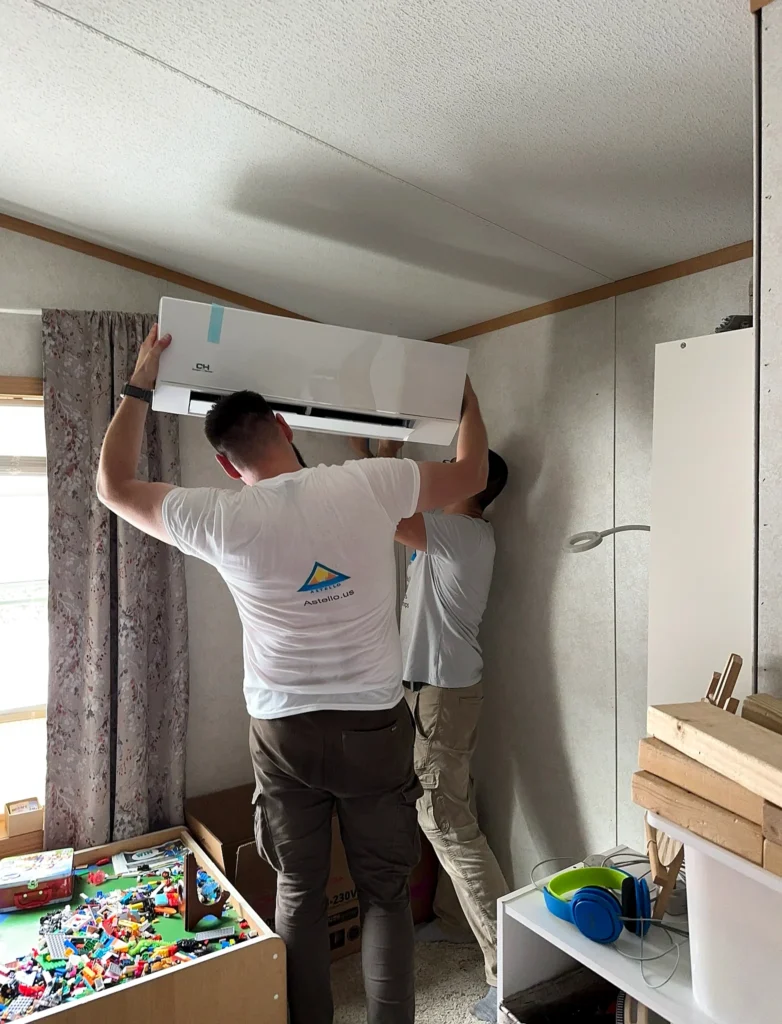 Astello LLC technicians installing a ductless cooper and hunter mini-split indoor wall unit, Saratoga, NY