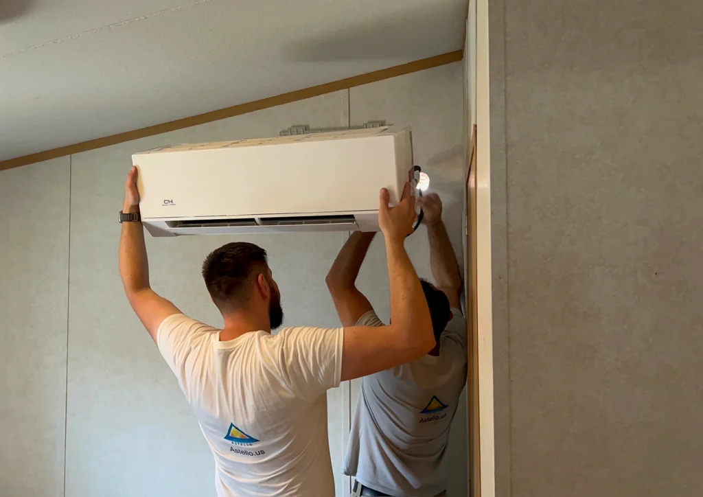 Astello LLC technicians installing a ductless cooper and hunter mini-split indoor wall unit, Saratoga, NY